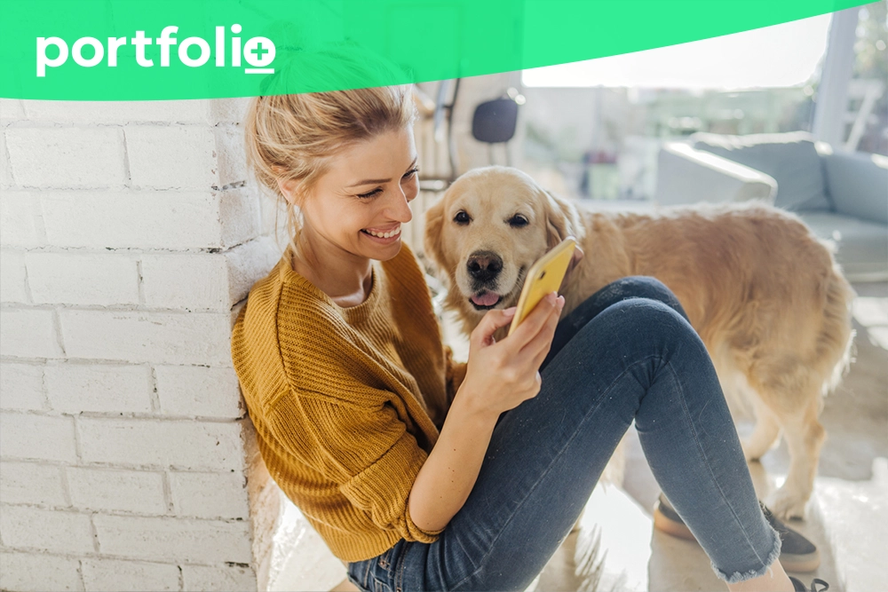 Young woman with golden retriever applying for EQ bank loan thanks to digital lending API innovations.